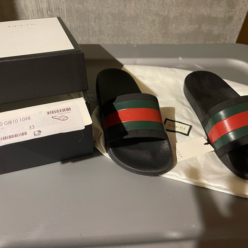Kids Gucci slides worn twice.